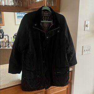 Barbour Men's black "Kelsey" wax jacket.